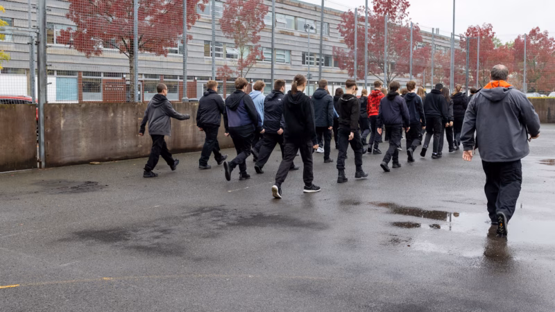 Public services students training in formation outdoors.