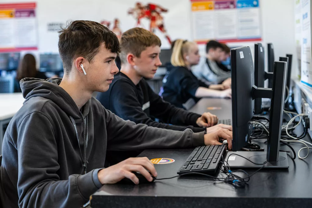 Classroom full of students working on computers