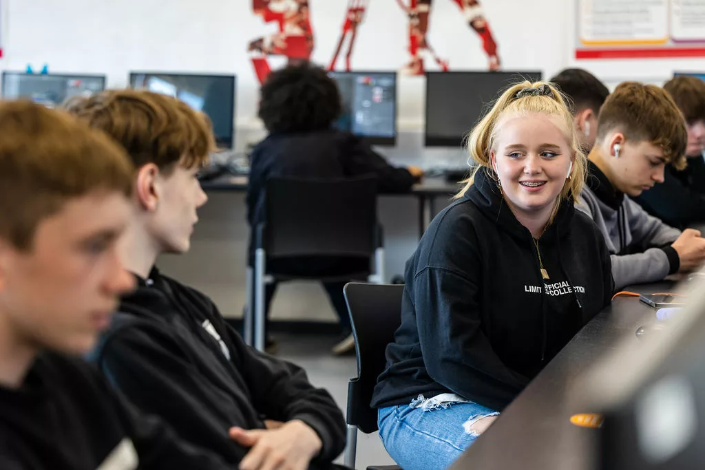 Classroom full of students talking together