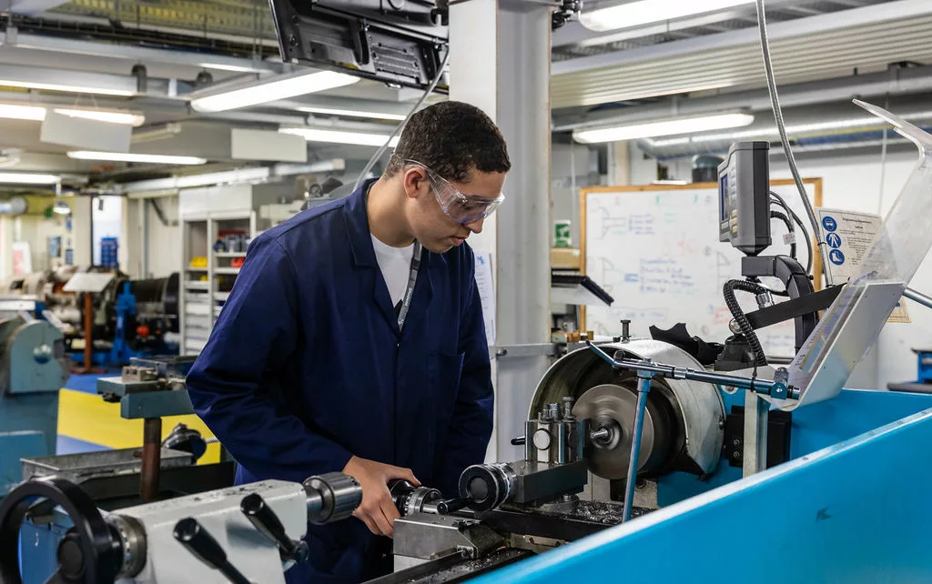 Students working in the engineering workshop at MK College