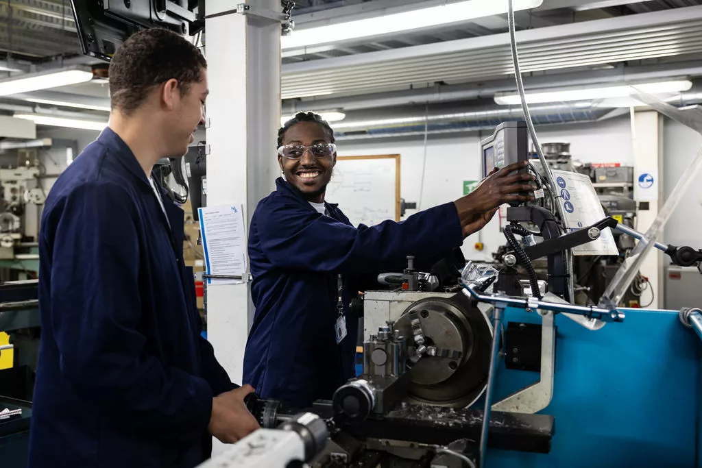 2 male Engineering students working in the workshop