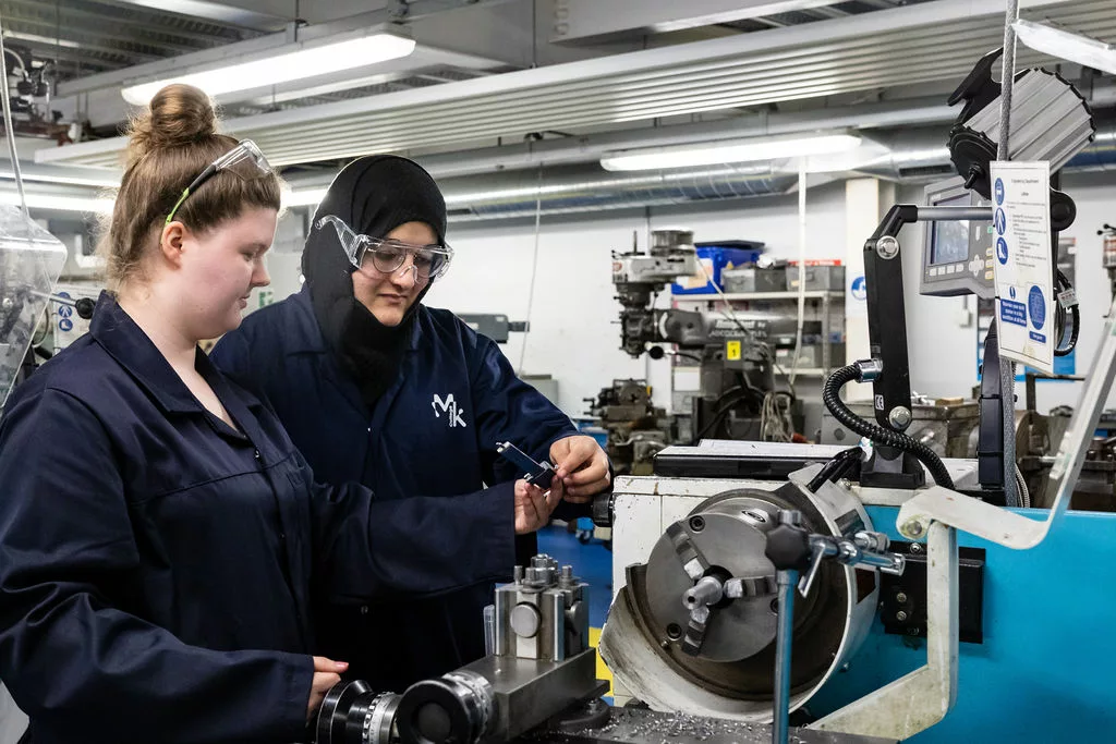 2 female Engineering students working in the workshop