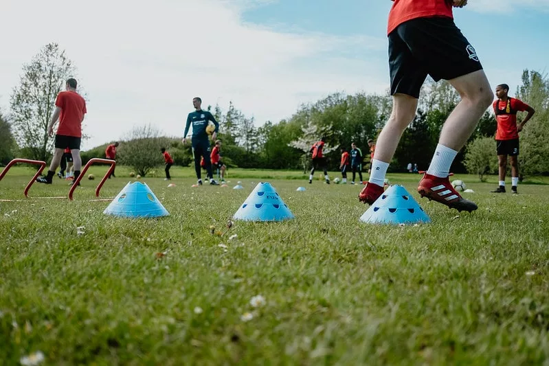 Students practicing football drills