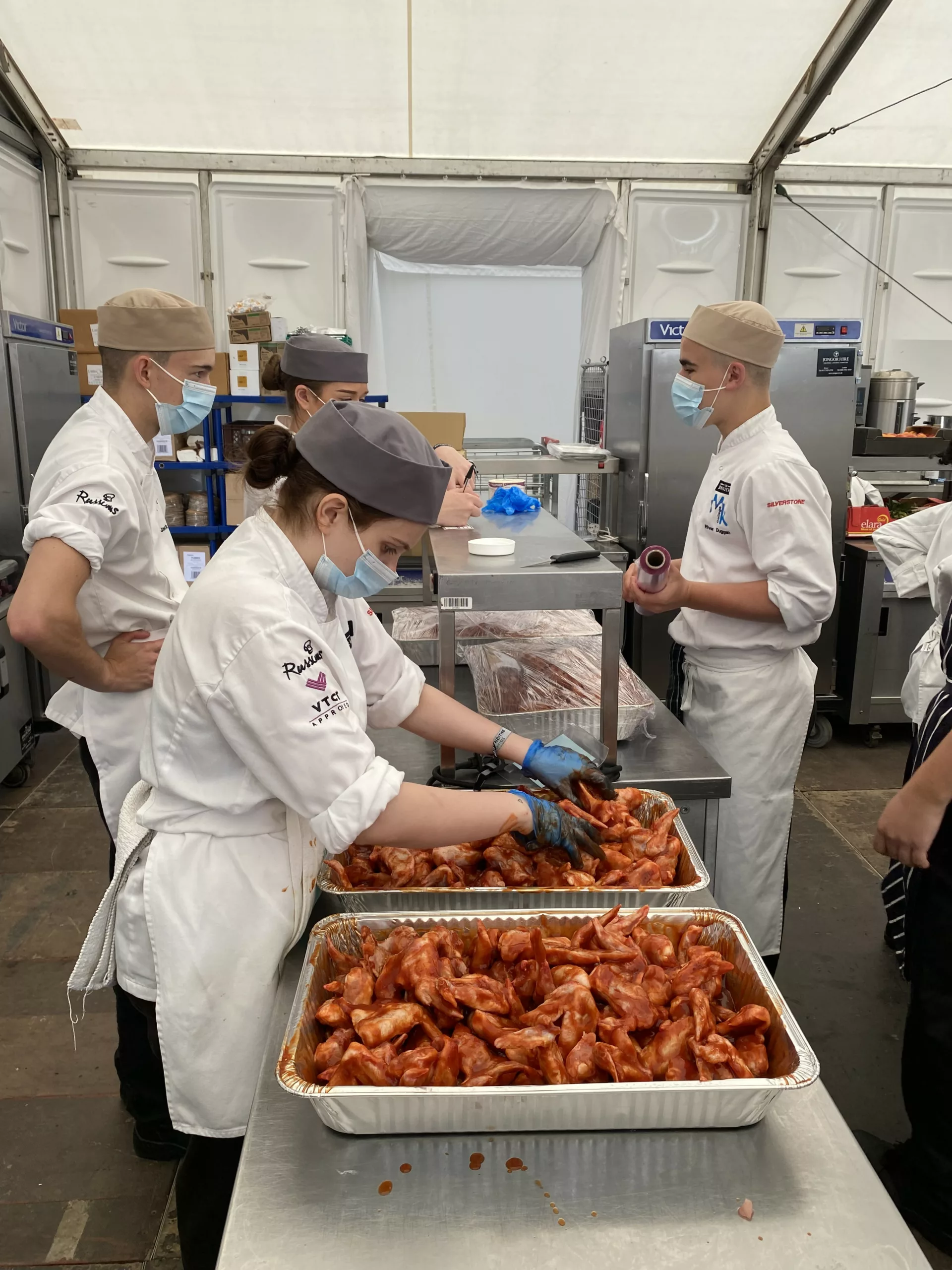 Catering students preparing food