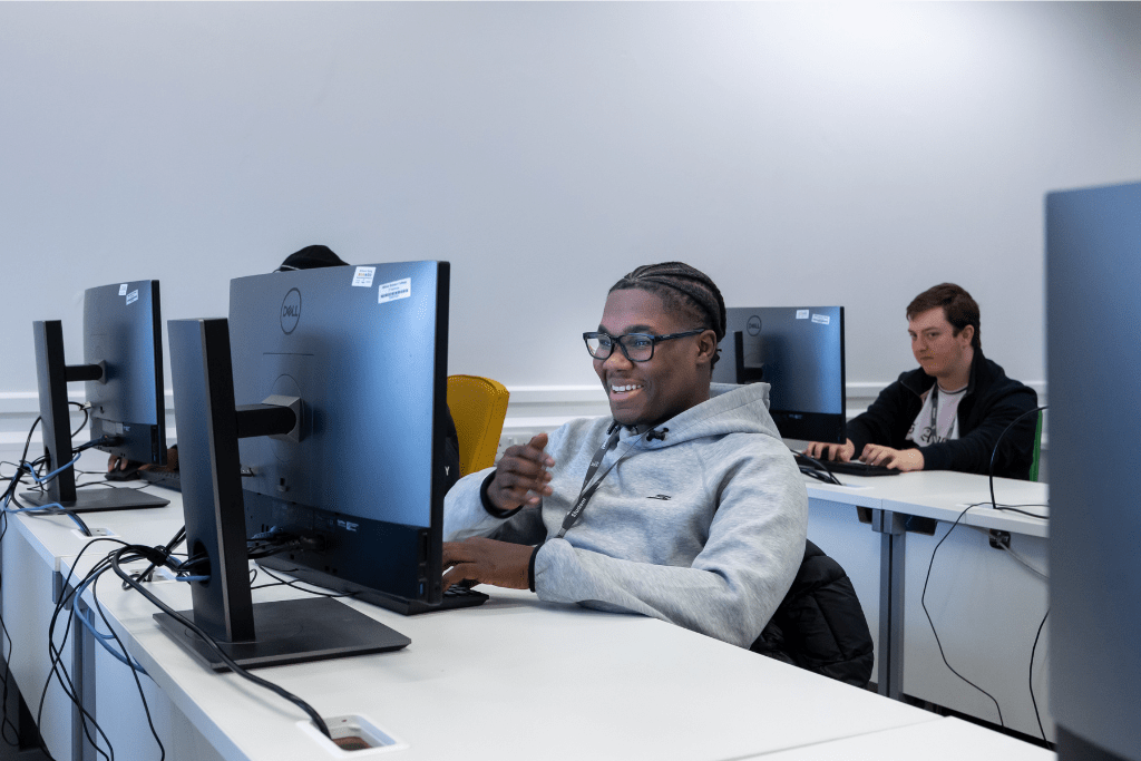 2 students working on desktop computers