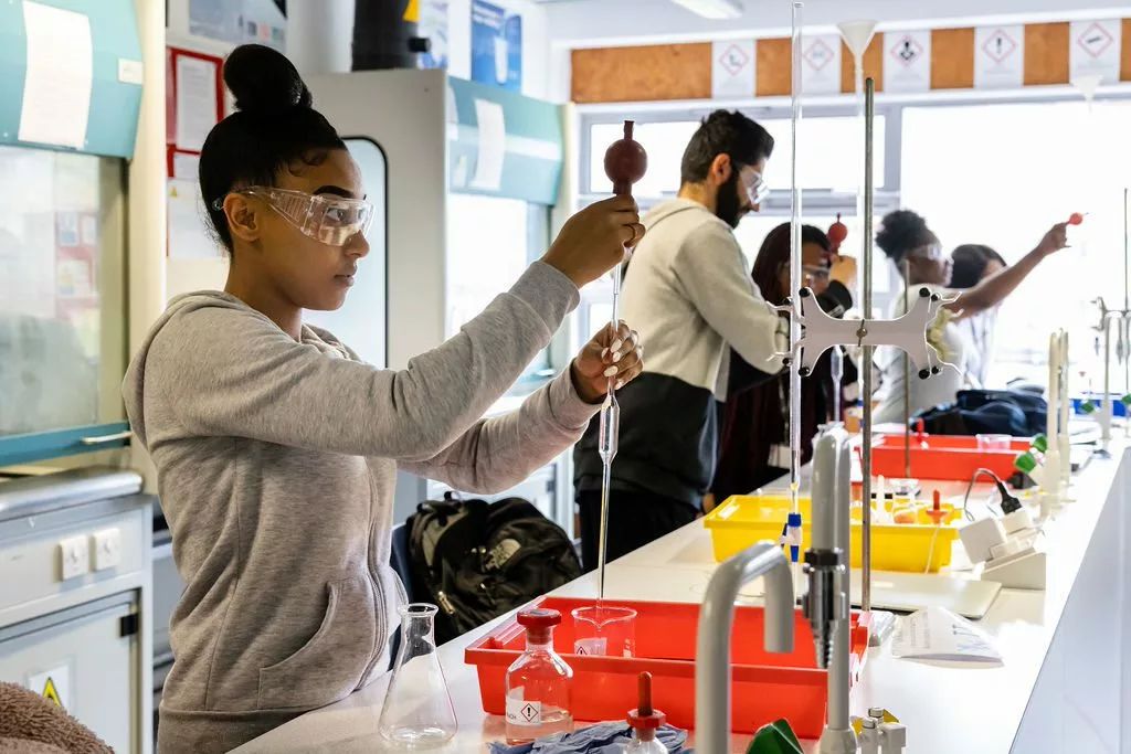 Students setting up equipment in the science lab