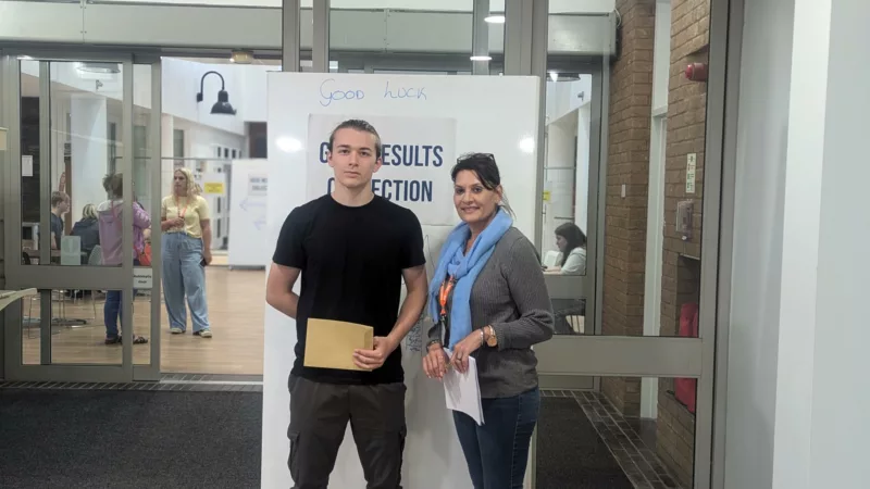 Alex Pollard and his tutor at Milton Keynes College on GCSE results day.