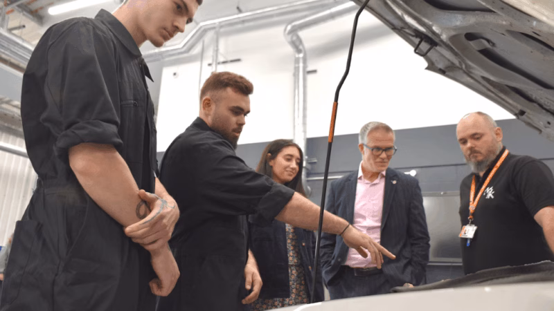 Motor Vehicle students from Milton Keynes College showing Chief Operating Officer Jason Mansell and COuncillor Shanika Mahendran what they're learning in the refurbished Motor Vehicle workshop.