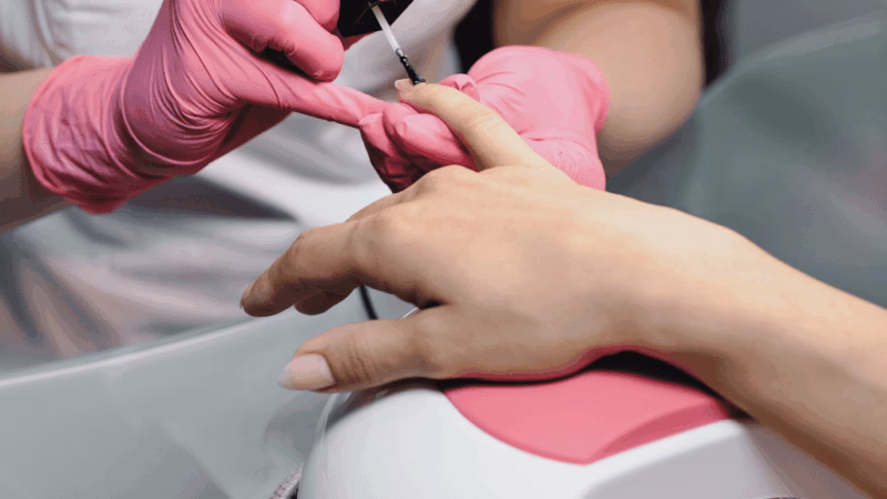 Close up of fingers being painted