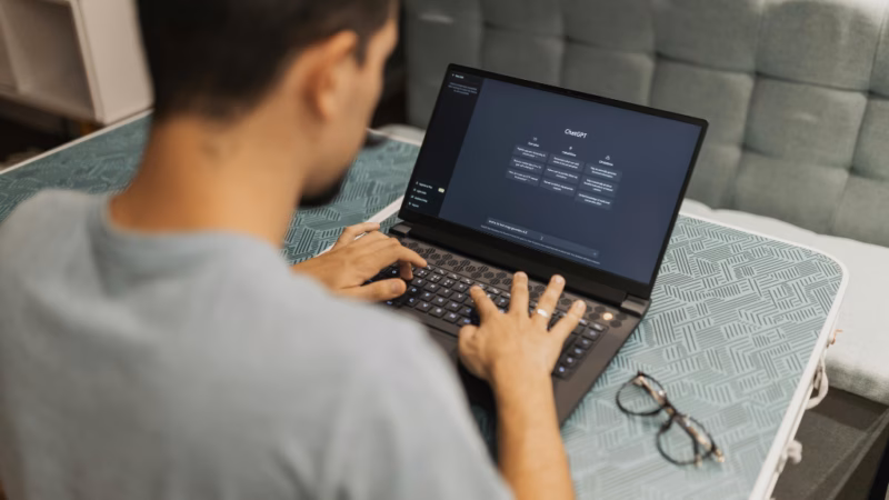 Adult learner using a laptop to explore artificial intelligence tools