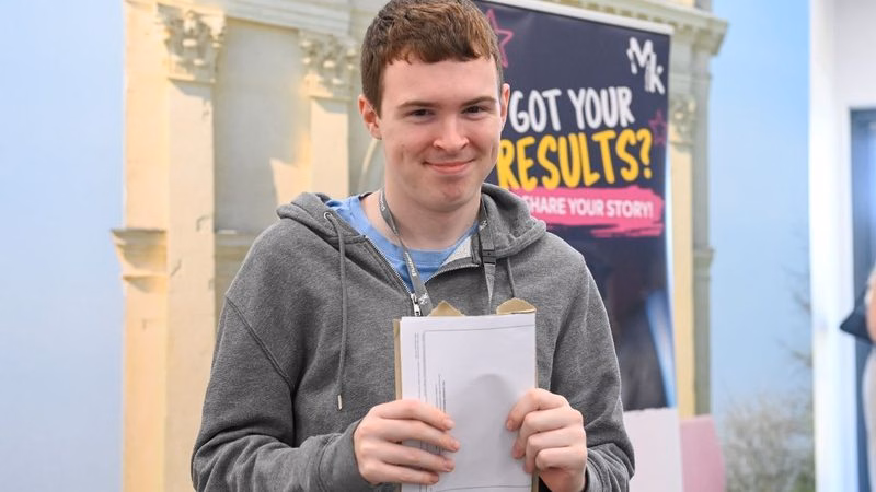 Harry Knight from MK College receiving his GCSE resit results.