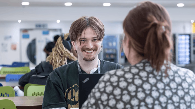 Milton Keynes College students talking to each other at the Chaffron Way campus.